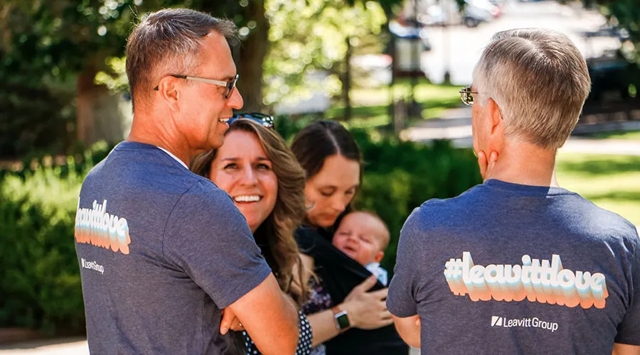 Employees wearing Leavitt Love shirts