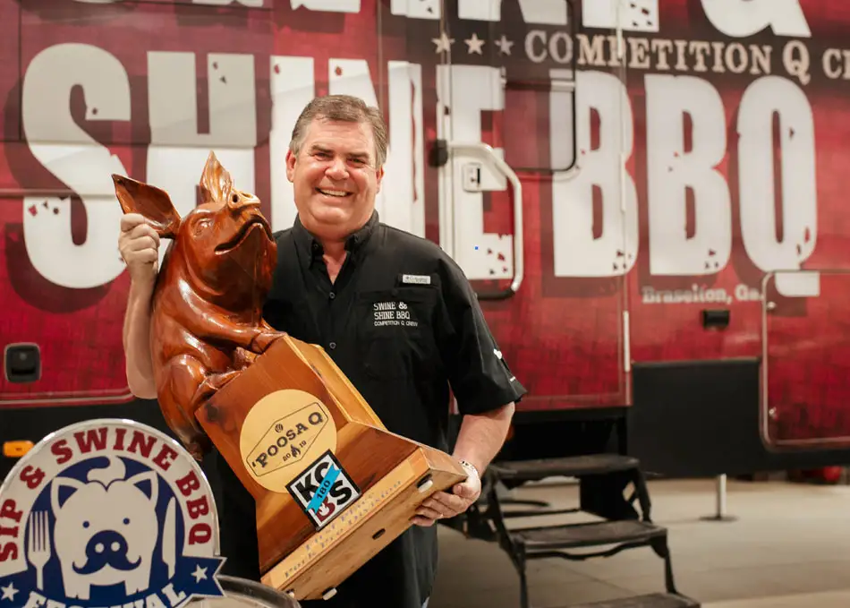 Jim Lloyd holding BBQ trophy