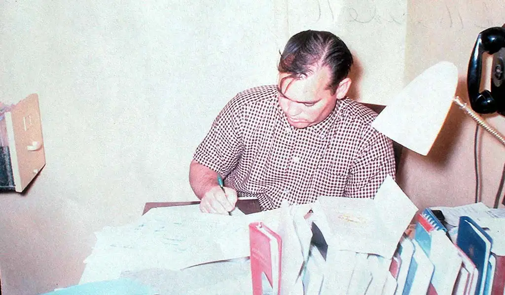 Dixie Leavitt at desk, 1952